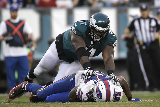 Philadelphia Eagles' Fletcher Cox (91) tackles Buffalo Bills' LeSean McCoy (25) during the second half of an NFL football game, Sunday, Dec. 13, 2015, in Philadelphia. (AP Photo/Michael Perez)