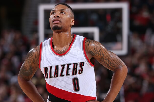 PORTLAND, OR - JANUARY 20:  Damian Lillard #0 of the Portland Trail Blazers looks on during the game against the Atlanta Hawks on January 20, 2016 at the Moda Center Arena in Portland, Oregon. NOTE TO USER: User expressly acknowledges and agrees that, by downloading and or using this photograph, user is consenting to the terms and conditions of the Getty Images License Agreement. Mandatory Copyright Notice: Copyright 2016 NBAE (Photo by Sam Forencich/NBAE via Getty Images)