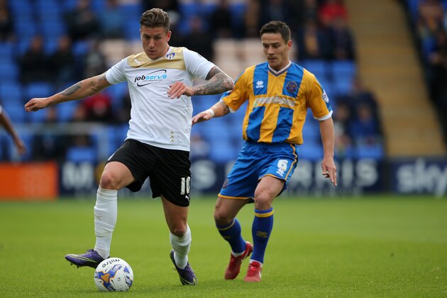 SHREWSBURY, ENGLAND - OCTOBER 10:  George Moncur of Colchester United and Ian Black of Shrewsbury Town during the Sky Bet League One match between Shrewsbury Town and Colchester United at New Meadow on October 10, 2015 in Shrewsbury, England.  (Photo by Matthew Ashton - AMA/Getty Images)