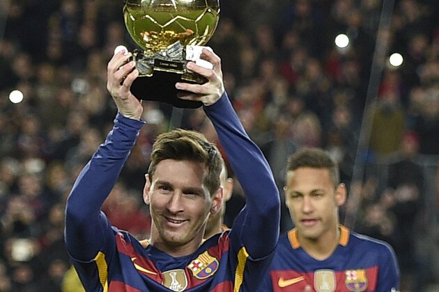Barcelona's Argentinian forward Lionel Messi poses with his fifth Ballon d'Or trophy before the Spanish league football match FC Barcelona vs Athletic Club Bilbao at the Camp Nou stadium in Barcelona on January 17, 2016. AFP PHOTO/ LLUIS GENE / AFP / LLUIS GENE        (Photo credit should read LLUIS GENE/AFP/Getty Images)