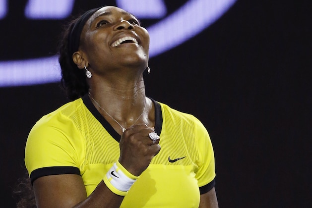 Serena Williams of the United States celebrates after defeating Agnieszka Radwanska of Poland in their semifinal match at the Australian Open tennis championships in Melbourne, Australia, Thursday, Jan. 28, 2016.(AP Photo/Vincent Thian)