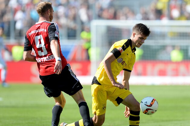 (L-R) Ingolstadt's striker Moritz Hartmann and Dortmund's midfielder Julian Weigl vie for the ball during the German first division Bundesliga football match FC Ingolstadt 04 vs Borussia Dortmund, on August 23, 2015 in Ingolstadt.  AFP PHOTO / CHRISTOF STACHE  RESTRICTIONS: DURING MATCH TIME: DFL RULES TO LIMIT THE ONLINE USAGE TO 15 PICTURES PER MATCH AND FORBID IMAGE SEQUENCES TO SIMULATE VIDEO.  == RESTRICTED TO EDITORIAL USE == FOR FURTHER QUERIES PLEASE CONTACT DFL DIRECTLY AT + 49 69 650050.        (Photo credit should read CHRISTOF STACHE/AFP/Getty Images)