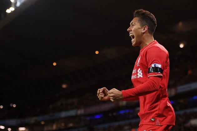 MANCHESTER, ENGLAND - NOVEMBER 21:  Roberto Firmino of Liverpool celebrates his team's first goal scored by Eliaquim Mangala of Manchester City during the Barclays Premier League match between Manchester City and Liverpool at Etihad Stadium on November 21, 2015 in Manchester, England.  (Photo by Michael Regan/Getty Images)