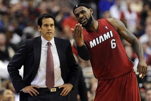 Miami Heats' LeBron James (6) talks to coach Eric Spoelstra in the second half of an NBA basketball game against the Philadelphia 76ers on Friday, Feb. 3, 2012, in Philadelphia. The Heat won 99-79. (AP Photo/Michael Perez)