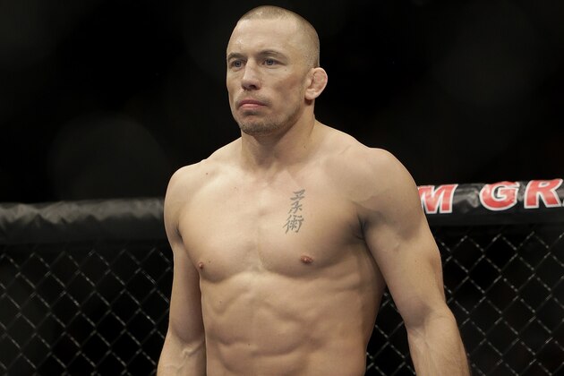 Georges St. Pierre, of Canada, waits to begin a UFC 167 mixed martial arts championship welterweight bout against Johny Hendricks on Saturday, Nov. 16, 2013, in Las Vegas. St. Pierre won by split decision. (AP Photo/Isaac Brekken)