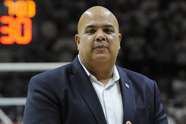 FILE - In this Dec. 5, 2015, file photo, UConn Athletic Director Warde Manuel is shown during a basketball game betweemn UConn and Notre Dame in Storrs, Conn. Two high ranking UConn officials say the school's athletic director has been offered the same job at Michigan. The officials spoke to The Associated Press on condition of anonymity Wednesday, Jan. 27, 2016, because Michigan has made no official announcements about the opening. (AP Photo/Jessica Hill, File)