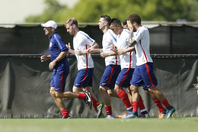 MIAMI SHORES, FL - NOVEMBER 9: Head coach Jurgen Klinsmann of the U.S. Men's National team leads players in a jog around the field during a training session on November 9, 2015 at Buccaneer Field on the campus of Barry University in Miami Shores, Florida. The team is in preparation for the start of qualifying for the 2018 FIFA World Cup. (Photo by Joel Auerbach/Getty Images)