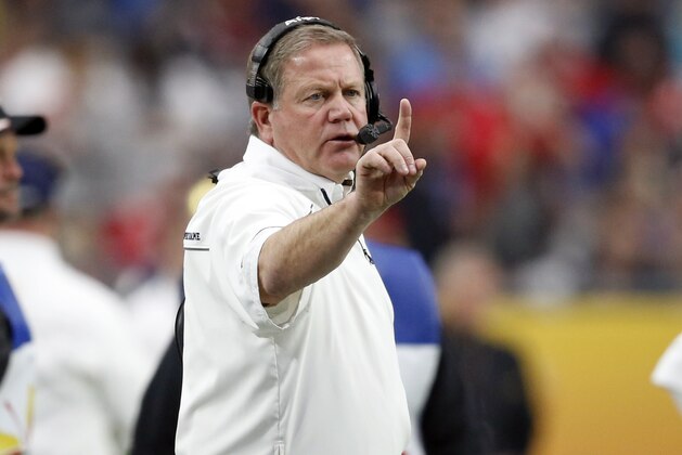 Notre Dame head coach Brian Kelly makes a call during the first half of the Fiesta Bowl NCAA College football game against Ohio State , Friday, Jan. 1, 2016, in Glendale, Ariz.  (AP Photo/Ross D. Franklin)
