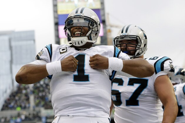 Carolina Panthers quarterback Cam Newton (1) reacts after he rushed for a touchdown in the first half of an NFL football game against the Seattle Seahawks, Sunday, Oct. 18, 2015, in Seattle. (AP Photo/Elaine Thompson)
