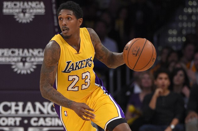 Los Angeles Lakers guard Lou Williams dribbles the ball during the second half of an NBA basketball game against the Denver Nuggets, Tuesday, Nov. 3, 2015, in Los Angeles. The Nuggets won 120-109. (AP Photo/Mark J. Terrill)