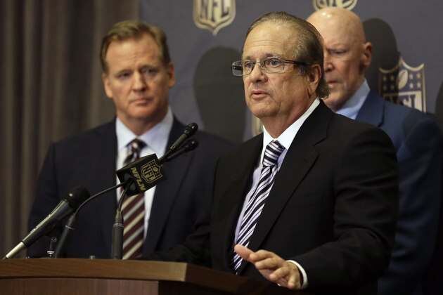 FILE - In this Jan. 12, 2016, file photo, NFL Commissioner Roger Goodell, left, listens as San Diego Chargers owner Dean Spanos talks to the media after team owners voted in Houston to allow the St. Louis Rams to move to a new stadium just outside Los Angeles, with the Chargers having an option to share the facility. The Chargers owner is feeling some pain after his fellow owners turned against him, though not nearly as much pain as he's inflicting on San Diego fans. (AP Photo/Pat Sullivan, File)