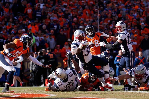 DENVER, CO - JANUARY 24:  Steven Jackson #39 of the New England Patriots rushes for a 1-yard touchdown in the first quarter against the Denver Broncos in the AFC Championship game at Sports Authority Field at Mile High on January 24, 2016 in Denver, Colorado.  (Photo by Christian Petersen/Getty Images)