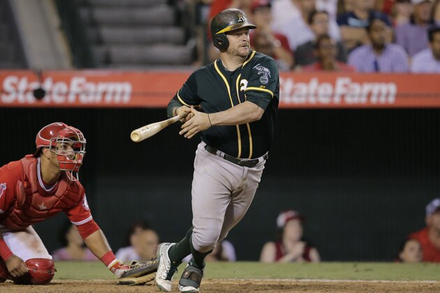 Oakland Athletics' Stephen Vogt hits a two-run single to lead the game during the seventh inning of a baseball game against the Los Angeles Angels, Wednesday, Sept. 30, 2015, in Anaheim, Calif. (AP Photo/Jae C. Hong)