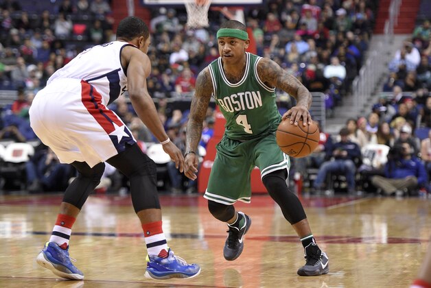 Boston Celtics guard Isaiah Thomas (4) dribbles the ball against Washington Wizards guard Ramon Sessions, left, during the second half of an NBA basketball game, Monday, Jan. 25, 2016, in Washington. The Celtics won 116-91. (AP Photo/Nick Wass)