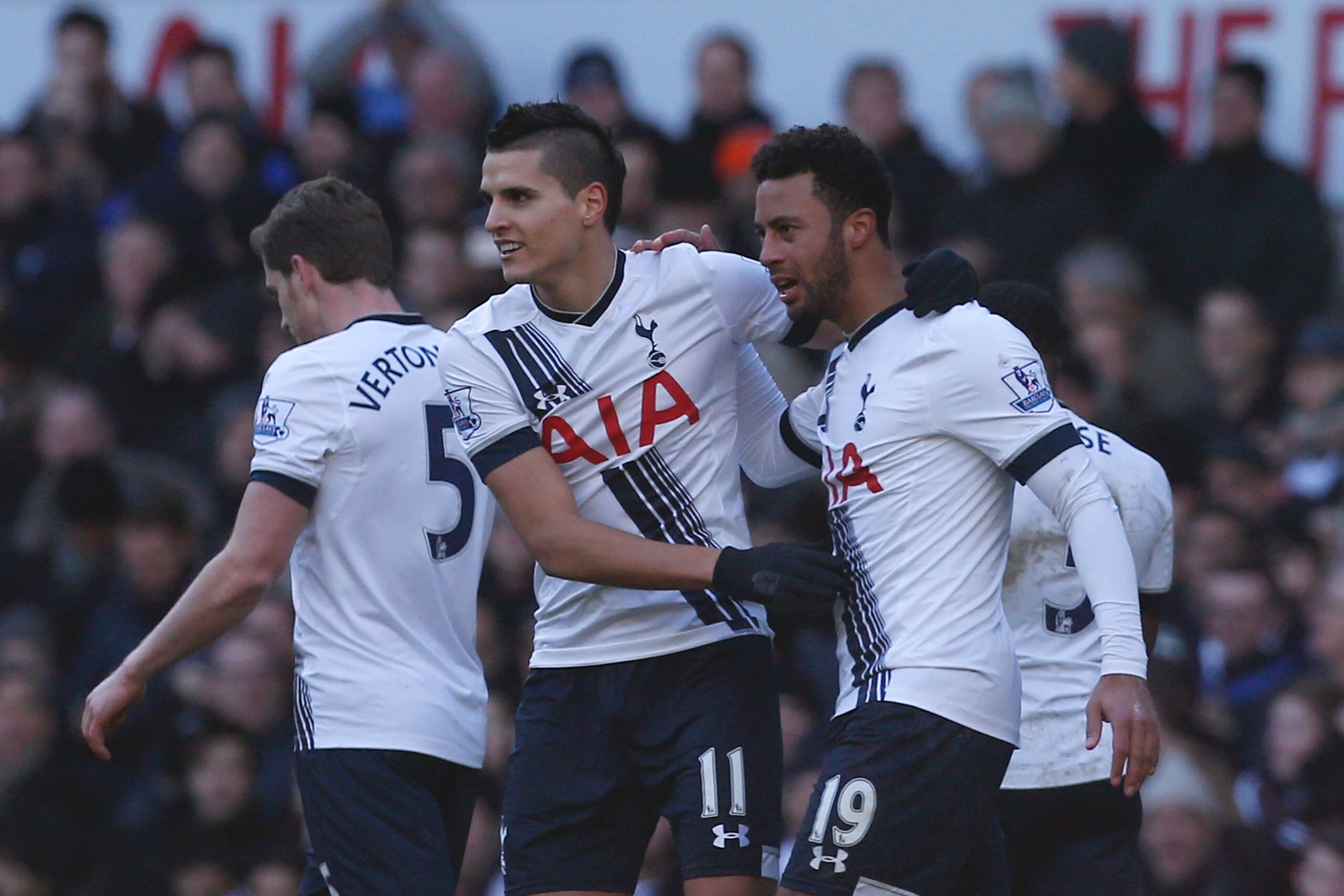 Tottenham Hotspur's Belgian midfielder Mousa Dembele (R) celebrates after scoring their second goal with Tottenham Hotspur's Argentinian midfielder Erik Lamela (C) during the English Premier League football match between Tottenham Hotspur and Sunderland at White Hart Lane in north London on January 16, 2016. AFP PHOTO / IAN KINGTONRESTRICTED TO EDITORIAL USE. No use with unauthorized audio, video, data, fixture lists, club/league logos or 'live' services. Online in-match use limited to 75 images, no video emulation. No use in betting, games or single club/league/player publications. / AFP / IAN KINGTON        (Photo credit should read IAN KINGTON/AFP/Getty Images)