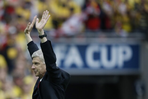 Arsenal's French manager Arsene Wenger acknowldeges the crowd after winning the FA Cup final football match between Aston Villa and Arsenal at Wembley stadium in London on May 30, 2015.       AFP PHOTO / ADRIAN DENNIS

NOT FOR MARKETING OR ADVERTISING USE / RESTRICTED TO EDITORIAL USE        (Photo credit should read ADRIAN DENNIS/AFP/Getty Images)