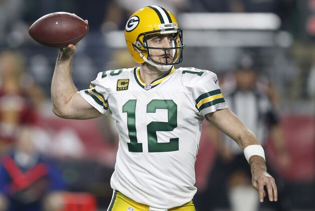 Green Bay Packers quarterback Aaron Rodgers (12) throws against the Arizona Cardinals during the second half of an NFL divisional playoff football game, Saturday, Jan. 16, 2016, in Glendale, Ariz. (AP Photo/Rick Scuteri)