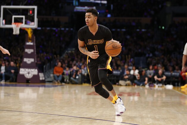 Los Angeles Lakers' D'Angelo Russell dribbles the ball against the Philadelphia 76ers during the second half of an NBA basketball game, Friday, Jan. 1, 2016, in Los Angeles. The Lakers won 93-84. (AP Photo/Danny Moloshok)