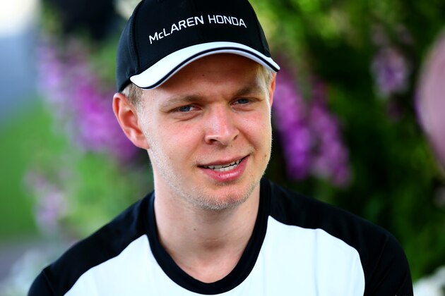 MELBOURNE, AUSTRALIA - MARCH 12:  Kevin Magnussen of Denmark and McLaren Honda speaks with members of the media in the paddock during previews to the Australian Formula One Grand Prix at Albert Park on March 12, 2015 in Melbourne, Australia.  (Photo by Mark Thompson/Getty Images)