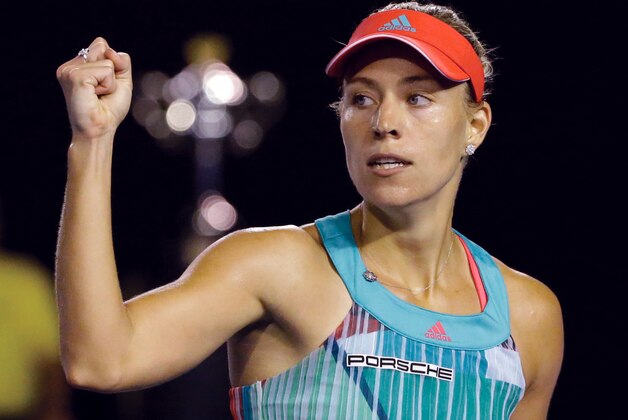 Angelique Kerber of Germany celebrates after winning a point against Serena Williams of the United States during the women's singles final at the Australian Open tennis championships in Melbourne, Australia, Saturday, Jan. 30, 2016.(AP Photo/Aaron Favila)