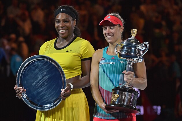 Angelique Kerber of Germany (R) holds the winner's trophy during the awards ceremony following her victory over Serena Williams of the US (L) in their women's singles final match on day 13 of the 2016 Australian Open tennis tournament in Melbourne on January 30, 2016. AFP PHOTO / PAUL CROCK -- IMAGE RESTRICTED TO EDITORIAL USE - STRICTLY NO COMMERCIAL USE / AFP / PAUL CROCK        (Photo credit should read PAUL CROCK/AFP/Getty Images)