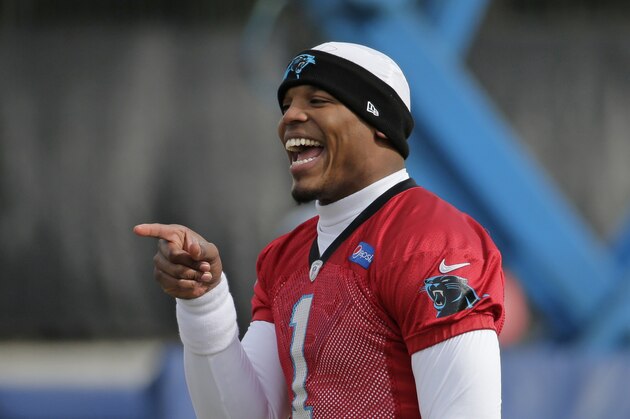Carolina Panthers' Cam Newton jokes with teammates during practice for the NFL football team in Charlotte, N.C., Wednesday, Jan. 27, 2016. (AP Photo/Chuck Burton)