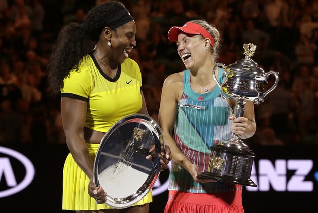 Angelique Kerber, right, of Germany enjoys a joke with runner-up Serena Williams of the United States after winning their women's singles final at the Australian Open tennis championships in Melbourne, Australia, Saturday, Jan. 30, 2016.(AP Photo/Aaron Favila)