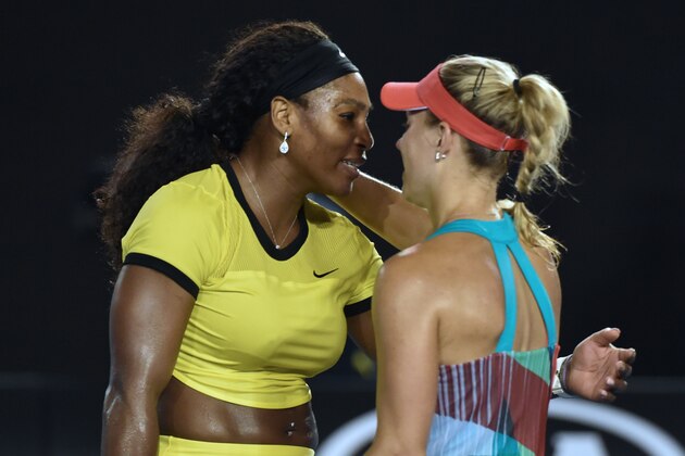 Germany's Angelique Kerber (R) embraces after victory in her women's singles final match against Serena Williams of the US (L) on day thirteen of the 2016 Australian Open tennis tournament in Melbourne on January 30, 2016. AFP PHOTO / SAEED KHAN-- IMAGE RESTRICTED TO EDITORIAL USE - STRICTLY NO COMMERCIAL USE / AFP / SAEED KHAN        (Photo credit should read SAEED KHAN/AFP/Getty Images)