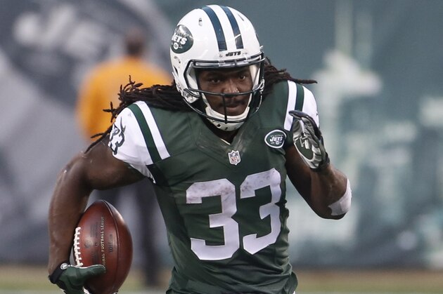 New York Jets running back Chris Ivory (33) rushes during the second half of an NFL football game against the Tennessee Titans Sunday, Dec. 13, 2015, in East Rutherford, N.J.  (AP Photo/Julio Cortez)