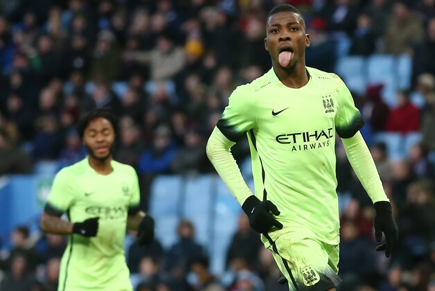 Manchester City's Nigerian striker Kelechi Iheanacho (R) celebrates after scoring his team's third goal during the English FA Cup fourth round football match between Aston Villa and Manchester City at Villa Park in Birmingham, central England, on January 30, 2016. / AFP / JUSTIN TALLIS / RESTRICTED TO EDITORIAL USE. No use with unauthorized audio, video, data, fixture lists, club/league logos or 'live' services. Online in-match use limited to 75 images, no video emulation. No use in betting, games or single club/league/player publications.  /         (Photo credit should read JUSTIN TALLIS/AFP/Getty Images)