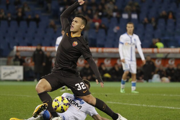 Roma's Leandro Paredes, top, earns a penalty kick as he is fouled by Empoli’s Piotr Zielinski during an Italian Cup soccer match between Roma and Empoli at Rome's Olympic Stadium, Tuesday, Jan. 20, 2015. (AP Photo/Andrew Medichini)