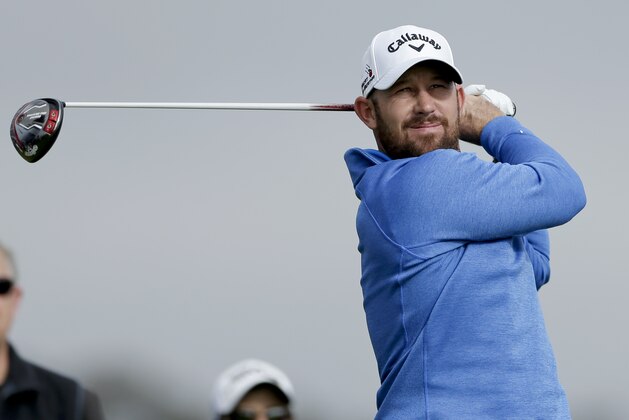 Scott Brown watches his tee shot on the second hole during the third round of the Farmers Insurance Open golf tournament Saturday, Jan. 30, 2016, in San Diego. (AP Photo/Gregory Bull)