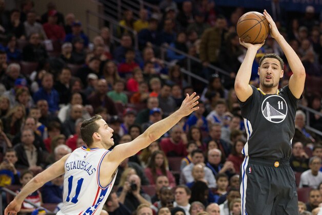 Jan 30, 2016; Philadelphia, PA, USA; Golden State Warriors guard Klay Thompson (11) shoots and scores over Philadelphia 76ers guard Nik Stauskas (11) during the first quarter at Wells Fargo Center. Mandatory Credit: Bill Streicher-USA TODAY Sports