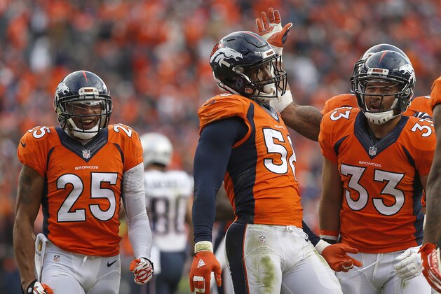 Denver Broncos outside linebacker Von Miller (58) is congratulated by his teammates after a play during the second half of the NFL football AFC Championship game between the Denver Broncos and the New England Patriots, Sunday, Jan. 24, 2016, in Denver. (AP Photo/David Zalubowski)