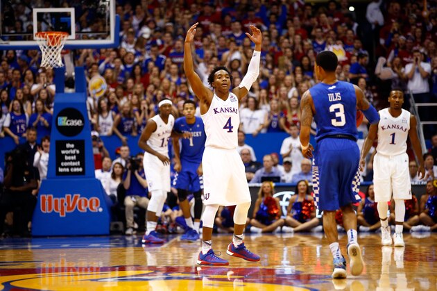LAWRENCE, KS - JANUARY 30:  Devonte' Graham #4 of the Kansas Jayhawks energizes the crowd during the 1st half of the game against the Kentucky Wildcats at Allen Fieldhouse on January 30, 2016 in Lawrence, Kansas.  (Photo by Jamie Squire/Getty Images)