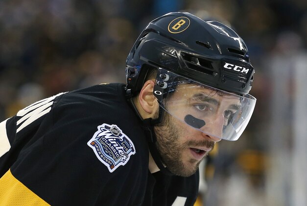 Boston Bruins' Patrice Bergeron during the second period of the NHL Winter Classic hockey game against the Montreal Canadiens at Gillette Stadium in Foxborough, Mass., Friday, Jan. 1, 2016. The Canadiens won 5-1. (AP Photo/Michael Dwyer)