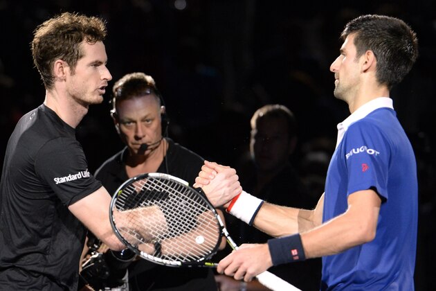 Serbia's Novak Djokovic (R) shakes hands with Britain's Andy Murray after winning the final tennis match at the ATP World Tour Masters 1000 indoor tennis tournament in Paris on November 8, 2015. AFP PHOTO / MIGUEL MEDINA        (Photo credit should read MIGUEL MEDINA/AFP/Getty Images)