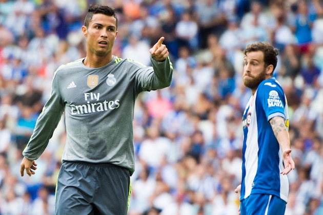 BARCELONA, SPAIN - SEPTEMBER 12: Cristiano Ronaldo of Real Madrid CF celebrates next to Jose Alberto Canas of RCD Espanyol after scoring his team's fifth goal during the La Liga match between RCD Espanyol and Real Madrid CF at Cornella-El Prat Stadium on September 12, 2015 in Barcelona, Spain. (Photo by Alex Caparros/Getty Images)