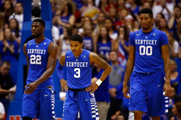 LAWRENCE, KS - JANUARY 30:  Alex Poythress #22, Tyler Ulis #3, and Marcus Lee #00 of the Kentucky Wildcats walk off the court during a timeout in the game against the Kansas Jayhawks at Allen Fieldhouse on January 30, 2016 in Lawrence, Kansas.  (Photo by Jamie Squire/Getty Images)
