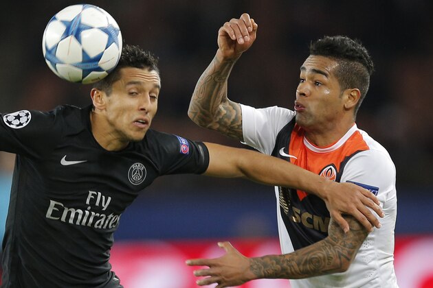 PSG's Marquinhos, left, challenges for the ball with Shakhtar's Alex Teixeira during the Champions League Group A soccer match between PSG and FC Shakhtar at the Parc des Princes stadium in Paris, France, Tuesday, Dec. 08, 2015. (AP Photo/Christophe Ena) PSG's Marquinhos, left, challenges for the ball with Shakhtar's Alex Teixeira during the Champions League Group A soccer match between PSG and FC Shakhtar at the Parc des Princes stadium in Paris, France, Tuesday, Dec. 08, 2015. (AP Photo/Christophe Ena)