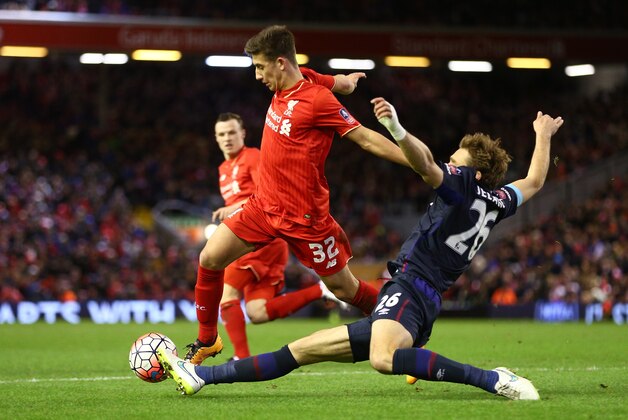 LIVERPOOL, ENGLAND - JANUARY 30: Cameron Brannagan of Liverpool is tackled by Nikica Jelavic of West Ham United during the Emirates FA Cup Fourth Round match between Liverpool and West Ham United at Anfield on January 30, 2016 in Liverpool, England. (Photo by Clive Brunskill/Getty Images) LIVERPOOL, ENGLAND - JANUARY 30: Cameron Brannagan of Liverpool is tackled by Nikica Jelavic of West Ham United during the Emirates FA Cup Fourth Round match between Liverpool and West Ham United at Anfield on January 30, 2016 in Liverpool, England. (Photo by Clive Brunskill/Getty Images)