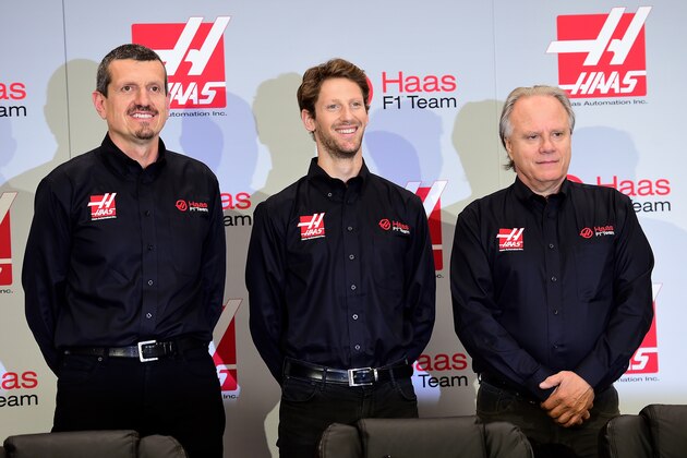 KANNAPOLIS, NC - SEPTEMBER 29:  (L-R) Gunther Steiner, team principal of Haas F1 Team, Romain Grosjean of France, and Gene Haas, owner of Haas F1 Team, pose for a photo opportunity after Haas F1 Team announced Grosjean as their driver for the upcoming 2016 Formula 1 season on September 29, 2015 in Kannapolis, North Carolina.  (Photo by Jared C. Tilton/Stewart-Haas Racing via Getty Images)