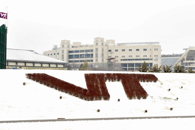 BLACKSBURG, VA - FEBRUARY 22: The Virginia Tech logo is seen with Lane Stadium in the background on February 22, 2013 in Blacksburg, Virginia. (Photo by Lance King/Getty Images)
