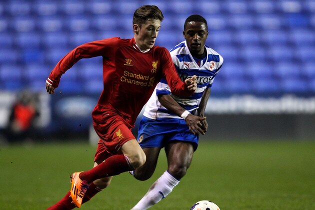 READING, ENGLAND - MARCH 12: Harry Wilson of Liverpool holds off pressure from Tarique Fosu of Reading during the FA Youth Cup 6th Round match between Reading U18 and Liverpool U18 at Madejski Stadium on March 12, 2014 in Reading, England.  (Photo by Ben Hoskins/Getty Images)