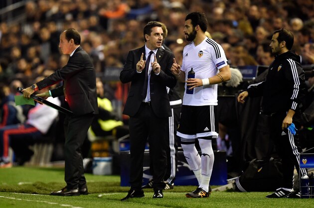 VALENCIA, SPAIN - DECEMBER 09:  Gary Neville manager of Valencia speaks with Alvaro Negredo of Valencia during the UEFA Champions League Group H match between Valencia CF and Olympique Lyonnais at Estadio Mestalla on December 9, 2015 in Valencia, Spain.  (Photo by Alex Caparros/Getty Images)