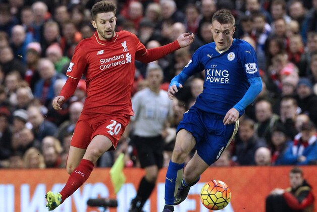 Leicester City's English striker Jamie Vardy (R) vies with Liverpool's English midfielder Adam Lallana (L) during the English Premier League football match between Liverpool and Leicester City at the Anfield stadium in Liverpool, north-west England on December 26, 2015.  AFP PHOTO / LINDSEY PARNABY

RESTRICTED TO EDITORIAL USE. No use with unauthorized audio, video, data, fixture lists, club/league logos or 'live' services. Online in-match use limited to 75 images, no video emulation. No use in betting, games or single club/league/player publications. / AFP / LINDSEY PARNABY        (Photo credit should read LINDSEY PARNABY/AFP/Getty Images)