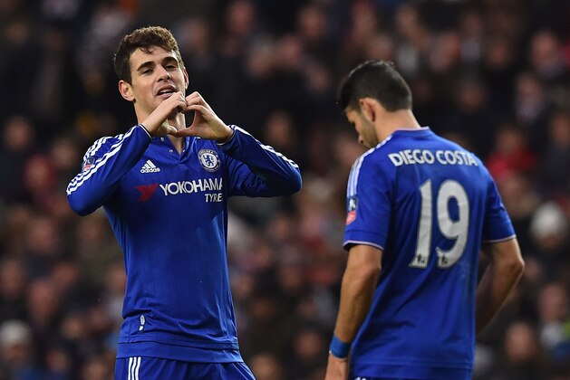 Chelsea's Brazilian midfielder Oscar (L) celebrates after scoring the opening goal of the English FA Cup fourth round football match between MK Dons and Chelsea at Stadium MK in Milton Keynes, central England, on January 31, 2016. / AFP / BEN STANSALL / RESTRICTED TO EDITORIAL USE. No use with unauthorized audio, video, data, fixture lists, club/league logos or 'live' services. Online in-match use limited to 75 images, no video emulation. No use in betting, games or single club/league/player publications.  /         (Photo credit should read BEN STANSALL/AFP/Getty Images)