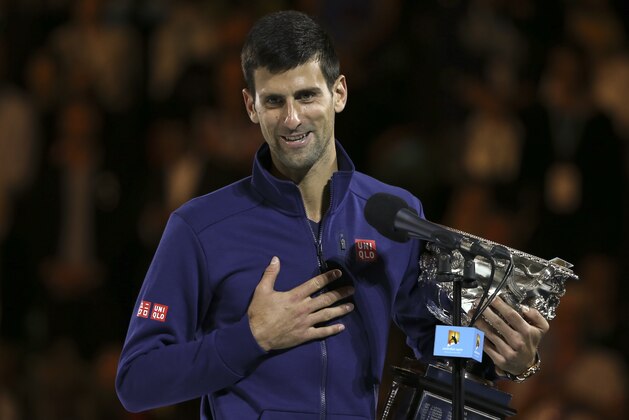 Novak Djokovic of Serbia addresses the crowd after defeating Andy Murray of Britain in the men's singles final at the Australian Open tennis championships in Melbourne, Australia, Sunday, Jan. 31, 2016.(AP Photo/Rick Rycroft)