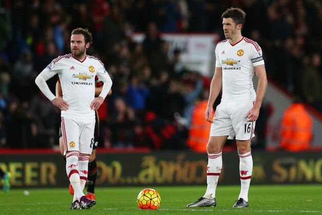 BOURNEMOUTH, ENGLAND - DECEMBER 12:  Juan Mata (L) and Michael Carrick (R) of Manchester United show their dejection after conceding second goal to Bournemouth during the Barclays Premier League match between A.F.C. Bournemouth and Manchester United at Vitality Stadium on December 12, 2015 in Bournemouth, United Kingdom.  (Photo by Steve Bardens/Getty Images)
