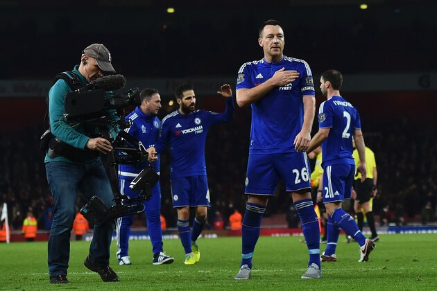 Chelsea's English defender John Terry (2nd R) gestures as he celebrate on the pitch after the English Premier League football match between Arsenal and Chelsea at the Emirates Stadium in London on January 24, 2016. Chelsea won the game 1-0. AFP PHOTO / BEN STANSALL

RESTRICTED TO EDITORIAL USE. No use with unauthorized audio, video, data, fixture lists, club/league logos or 'live' services. Online in-match use limited to 75 images, no video emulation. No use in betting, games or single club/league/player publications. / AFP / BEN STANSALL        (Photo credit should read BEN STANSALL/AFP/Getty Images)